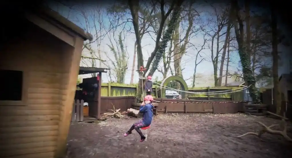 Participants enjoying a team-building exercise at Fota Island Adventure, surrounded by nature.
