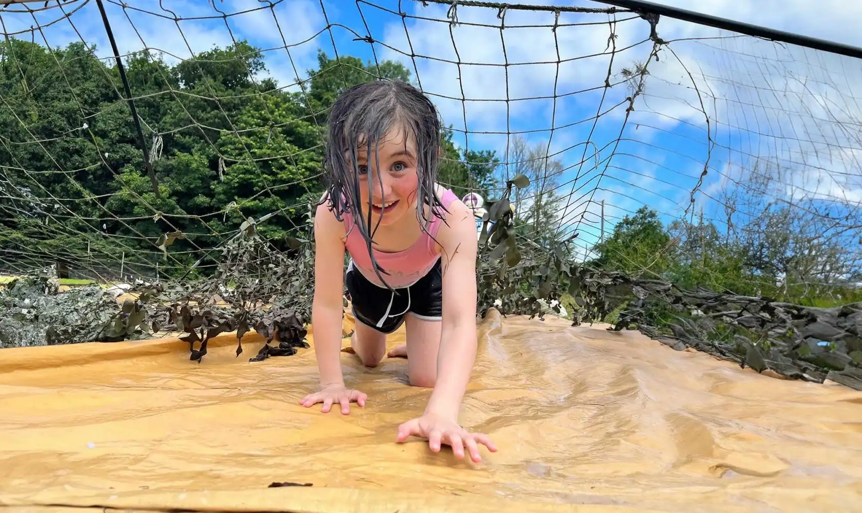 Children gathered around a campfire at Fota Island Adventure camp