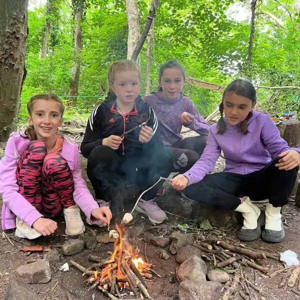 Campers enjoying a zip line ride at Fota Island Adventure