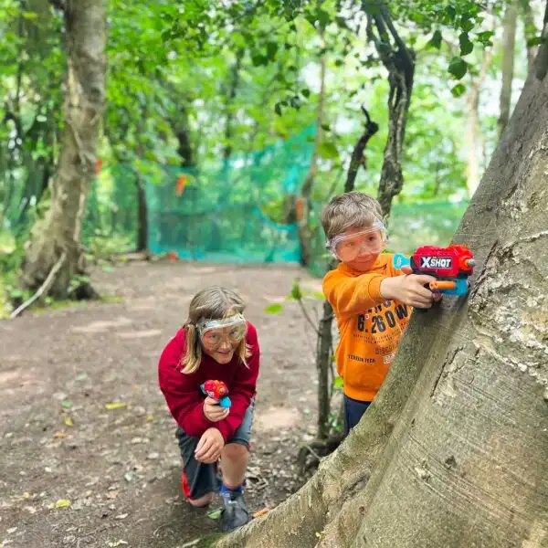 Group of teenagers climbing a rock wall at Fota Island Adventure