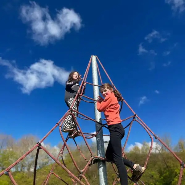 Children playing a group game on the field at Fota Island Adventure