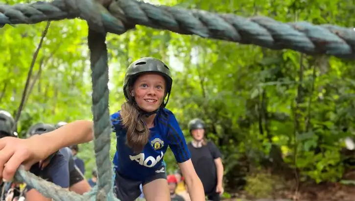 Campers kayaking on a lake at Fota Island Adventure