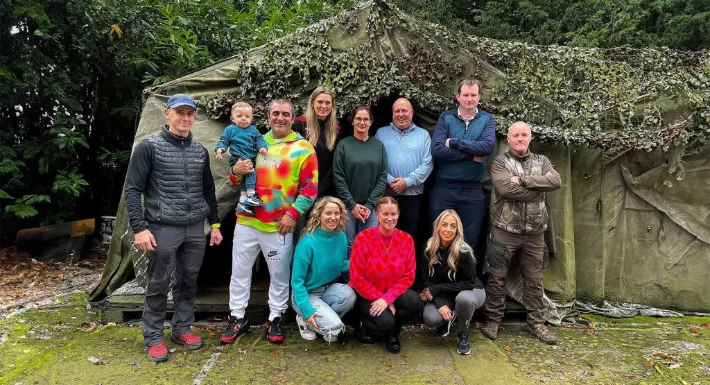 Corporate team engaged in a high ropes course challenge at Fota Island Adventure