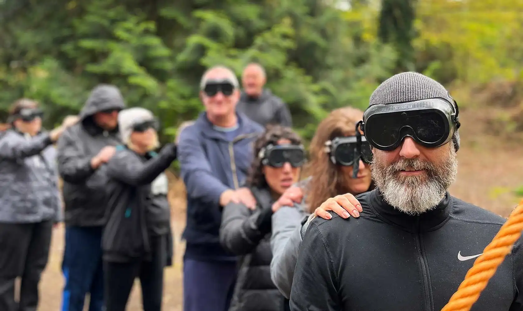Group of colleagues participating in a team-building exercise at Fota Island Adventure, surrounded by lush greenery.