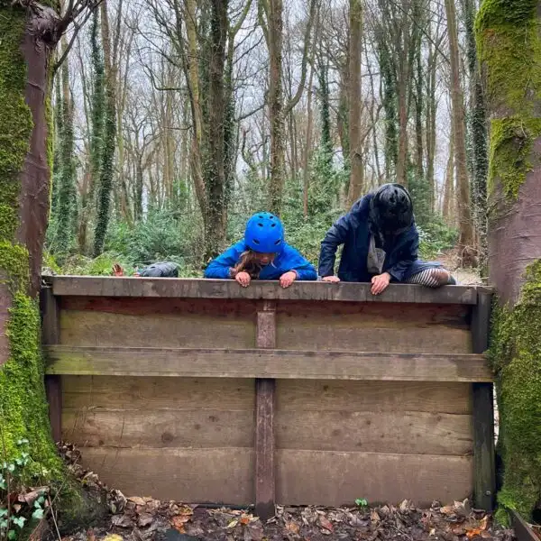 A family hiking through a forest trail at Fota Island Adventure