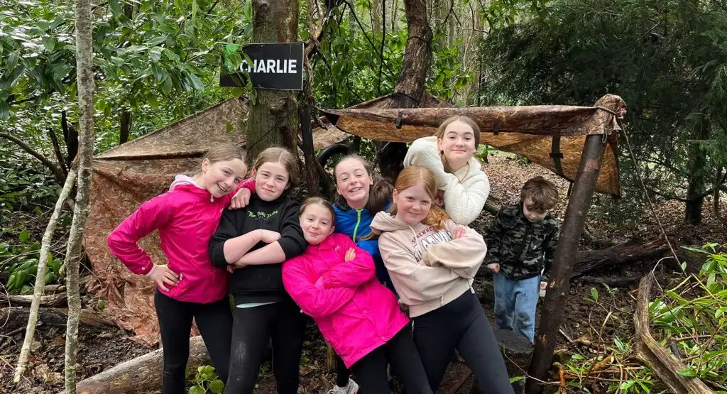 A family playing a game of archery at Fota Island Adventure
