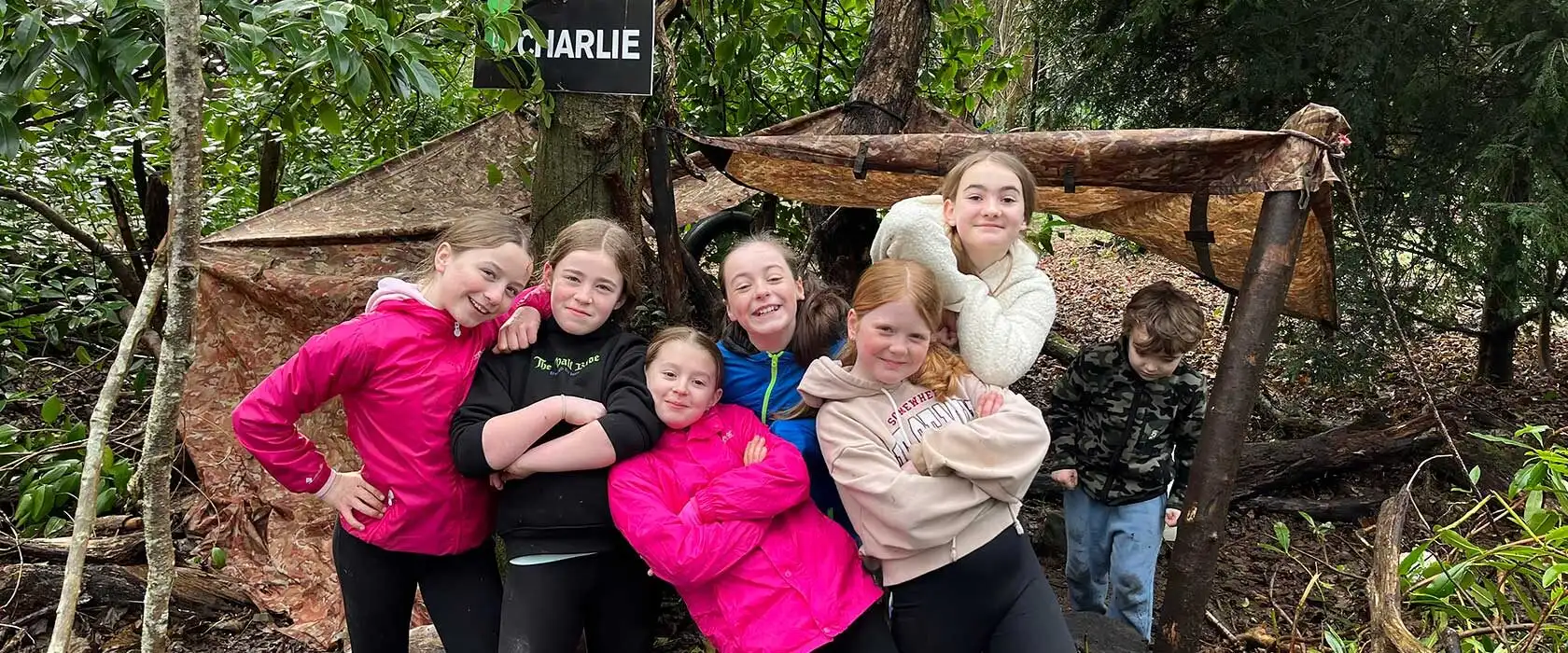 A family playing a game of archery at Fota Island Adventure