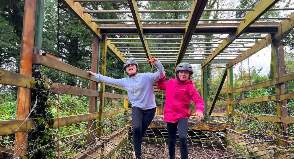 Aerial view of a group of friends kayaking through a scenic waterway at Fota Island Adventure, surrounded by lush greenery
