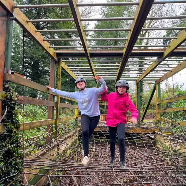 Aerial view of a group of friends kayaking through a scenic waterway at Fota Island Adventure, surrounded by lush greenery