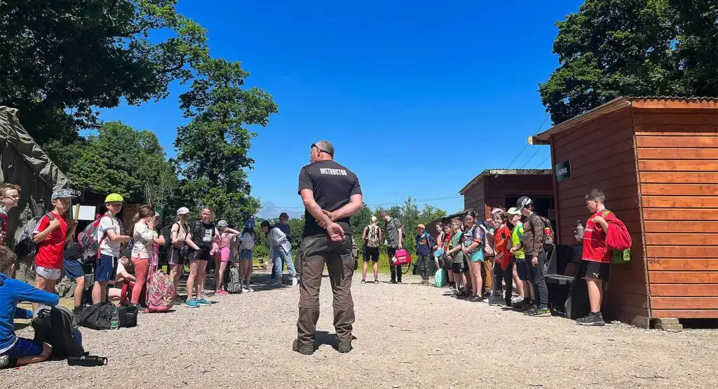 Participants navigating through a forest trail during an orienteering event at Fota Island Adventure, holding maps and compasses.
