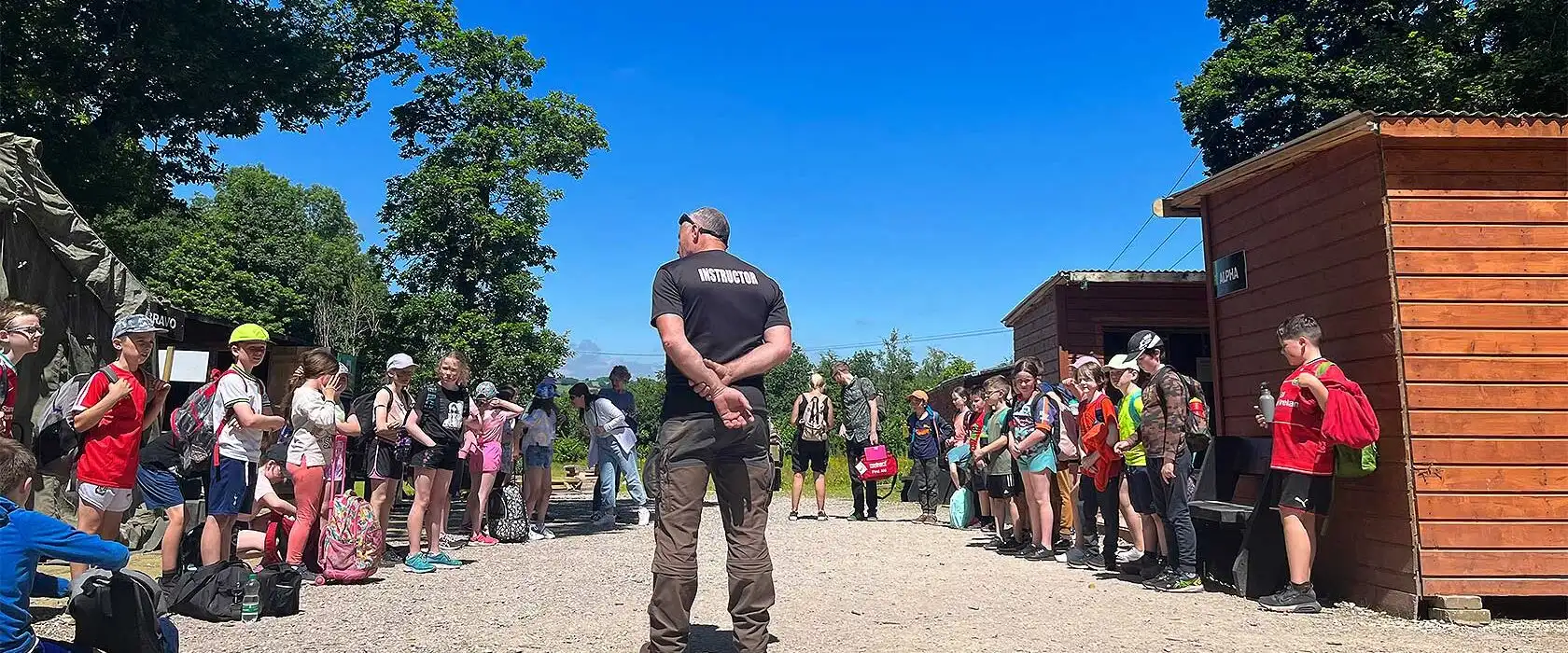 Participants navigating through a forest trail during an orienteering event at Fota Island Adventure, holding maps and compasses.