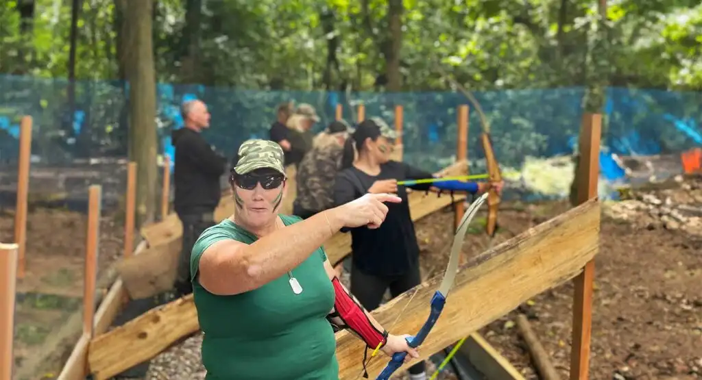 Group celebrating after completing an obstacle course at Fota Island Adventure