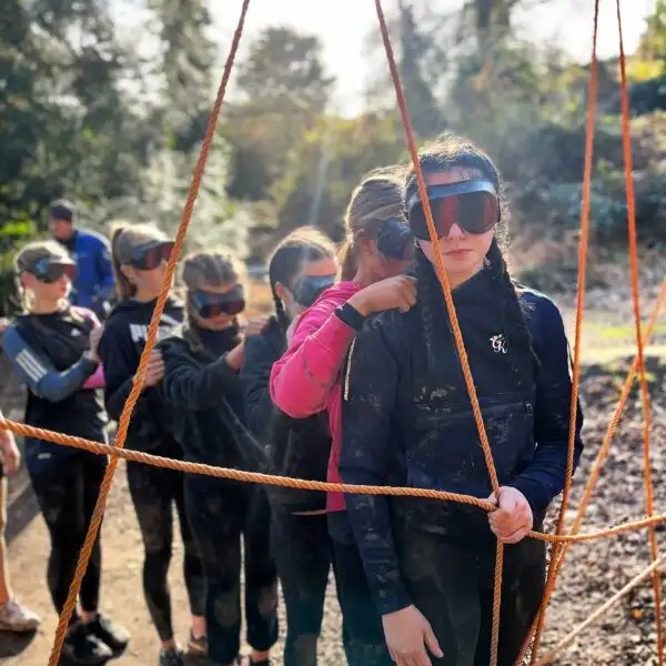 A team at Fota Island Adventure participating in a problem-solving challenge that requires innovative thinking.