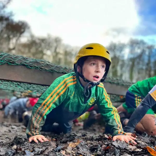 Team members at Fota Island Adventure engaged in a collaborative task that requires effective communication and teamwork.
