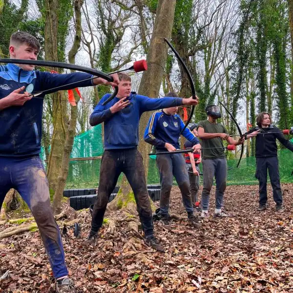 Team members at Fota Island Adventure engaged in a problem-solving exercise that requires innovative solutions.