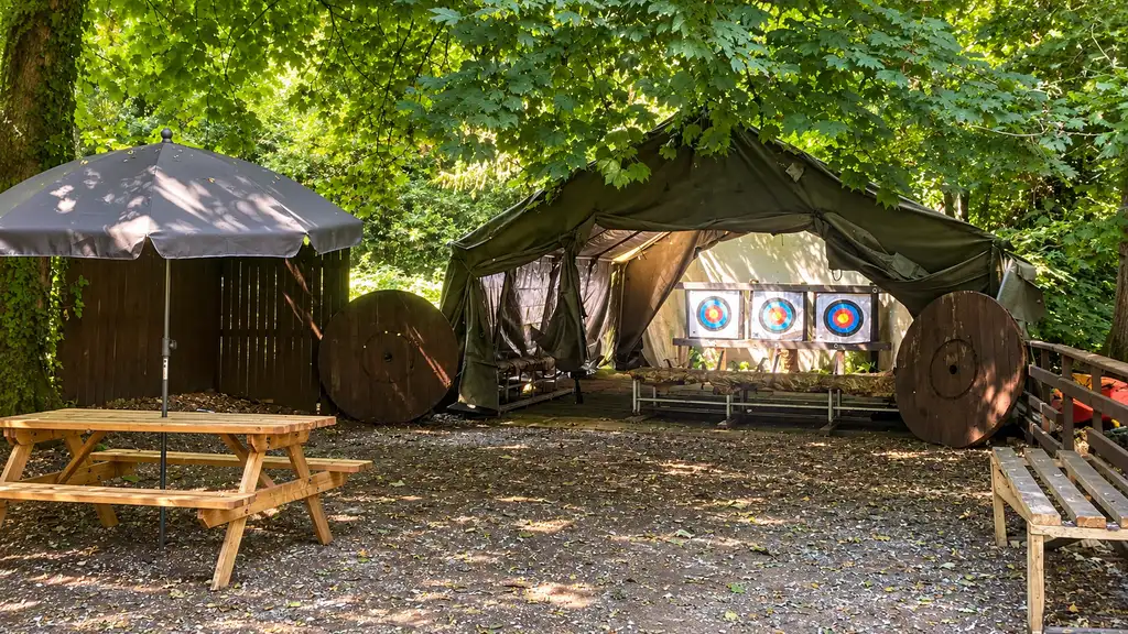 Archery activity area in the woodland at Fota Adventure with targets and outdoor seating